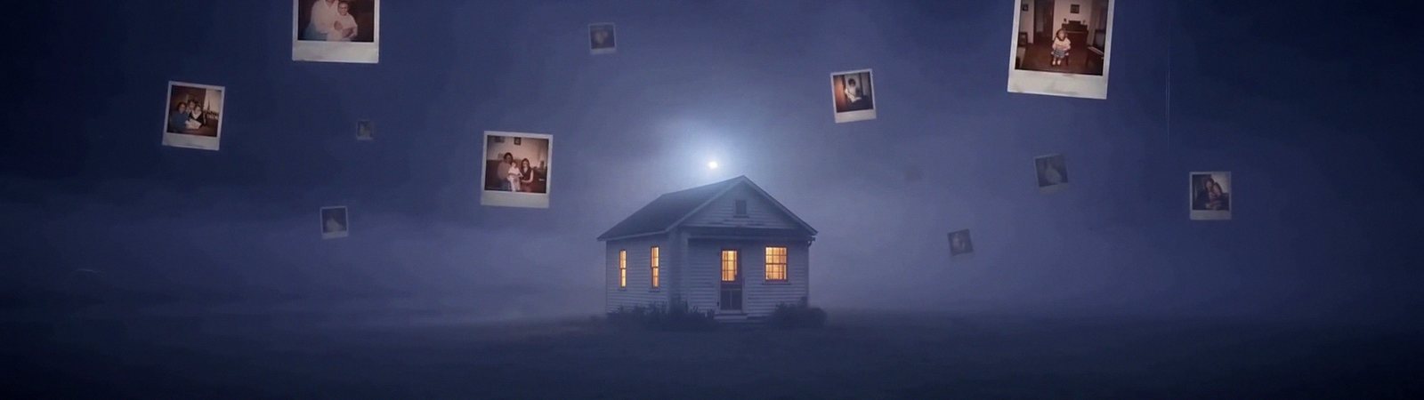 A small white house with lit windows alone on a dark plain in the violet fog, photographs floating around it